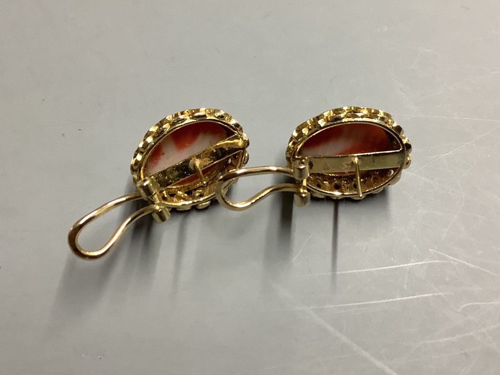 A pair of carved coral oval earrings,